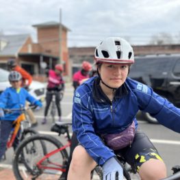 Young Mexican girl on mountain bike smiling and looking into the camera