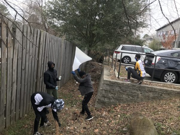 Triangle Bikeworks youth picking up trash